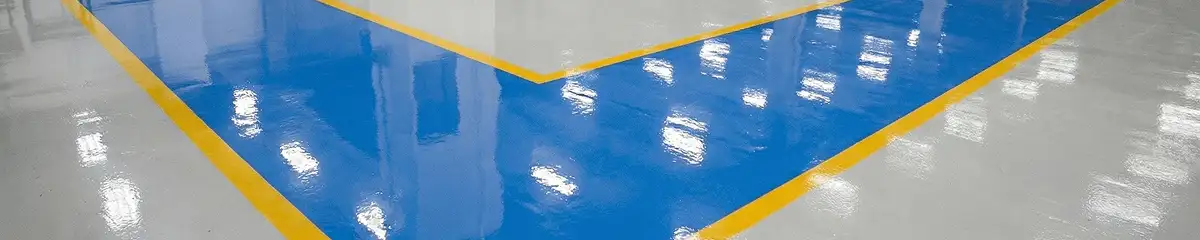 A factory floor professionally covered and marked with epoxy flooring in Madison, WI