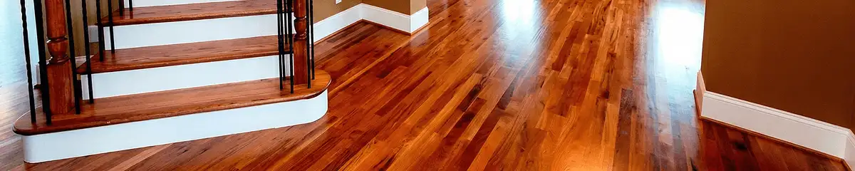 Base floor of a staircase with professionally restored wood flooring in Madison WI