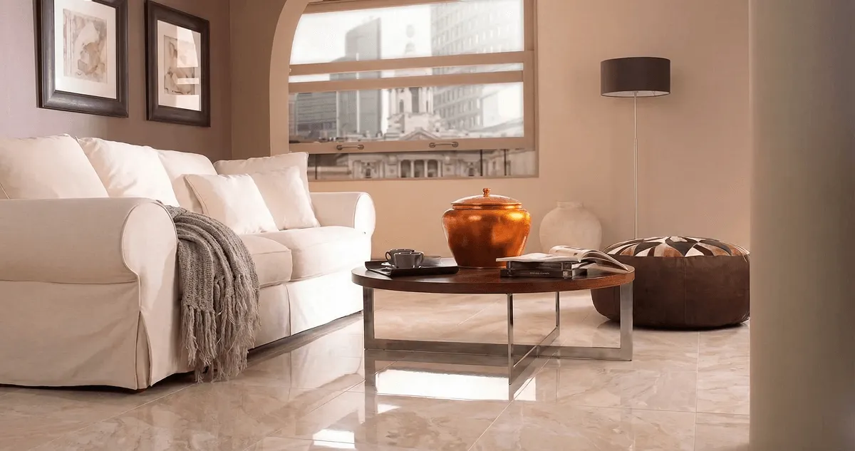 Modern living room with professionally installed marble flooring, a beige sofa, coffee table in Madison, WI