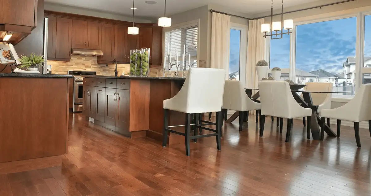 A modern kitchen with professionally installed wood flooring in Madison, WI